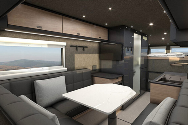 Camper van interior with seating and kitchen